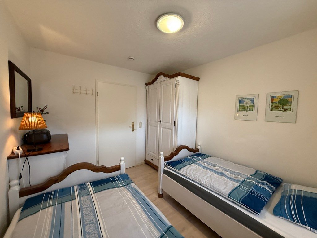 Schlafzimmer mit Einzelbetten in der Bültensünn